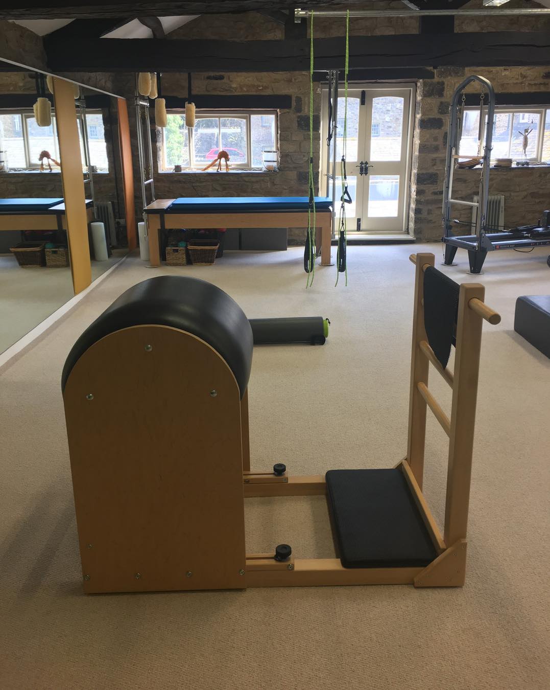We often get asked if we do reformer classes.
Yes we have two reformers, but no we don’t run reformer classes exclusively.
As a Comprehensive Pilates Instructor, I teach the entire Pilates system - not just reformer classes - because Joseph Pilates designed his method as an interconnected, full-body approach using a variety of apparatus, each serving a unique purpose within the system.
The full Pilates system includes the Reformer, Cadillac, Wunda Chair, Ladder Barrel, Spine Corrector, Mat, and several smaller pieces of equipment. Each apparatus is designed to complement the others, helping the body find balance, strength, and control through a progressive and intelligently structured method. By working with the full range of equipment, I can tailor sessions precisely to each individual’s needs - whether that means supporting, challenging, or refining their movement in a way that a one-size-fits-all reformer class simply cannot.
While reformer classes can offer a great workout, they tend to be more generalised. Everyone in the room performs the same sequences, often at a similar pace, using the same springs and setup. The focus is typically on fitness rather than the therapeutic and corrective power of Pilates as a complete system.
In contrast, teaching the full system allows for a far more holistic and personalised experience. I can choose the right apparatus for each client’s body and goals on any given day - using the Cadillac to build stability, the Chair to develop power and balance, or the Barrels to restore alignment and flexibility. This way, the work meets the body where it is, rather than forcing the body to fit the work.
Ultimately, teaching the full Pilates system honours the original intention of Joseph Pilates - a complete method of movement that integrates mind, body, and spirit, and restores natural strength and vitality through precision and progression. It’s not just a class - it’s a whole-body education in movement.