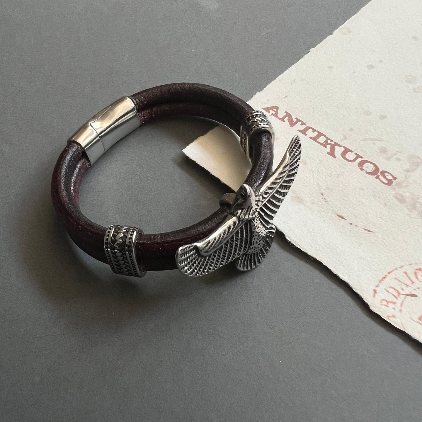 A large leather bracelet in an antique brown colour with an eagle charm as a focal point. Made with high quality soft goat's leather. It measures 12 mm ( 0.5 inches) in width ( 6 mm each leather strand) and has a stainless steel magnetic clasp with a pin for extra security. The eagle is 5 cm wide ( 2 inches) and is made of stainless steel. .
.
.
#Mens eagle bracelet #eagle bracelet #unisex customized jewellery #leather bracelet #bohemian jewellery