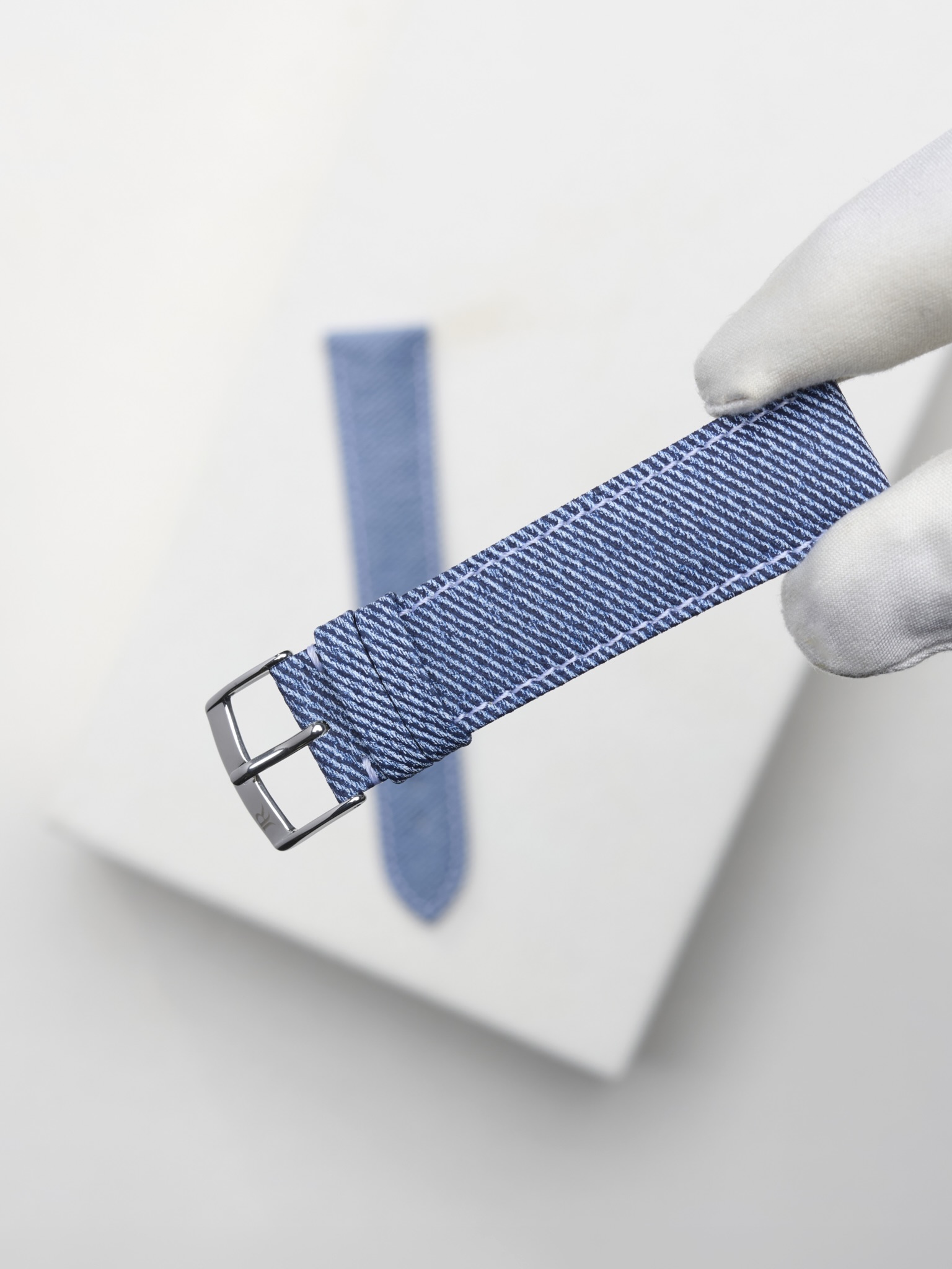 Designed to echo the texture of denim, this calf leather features a mechanically applied diagona....