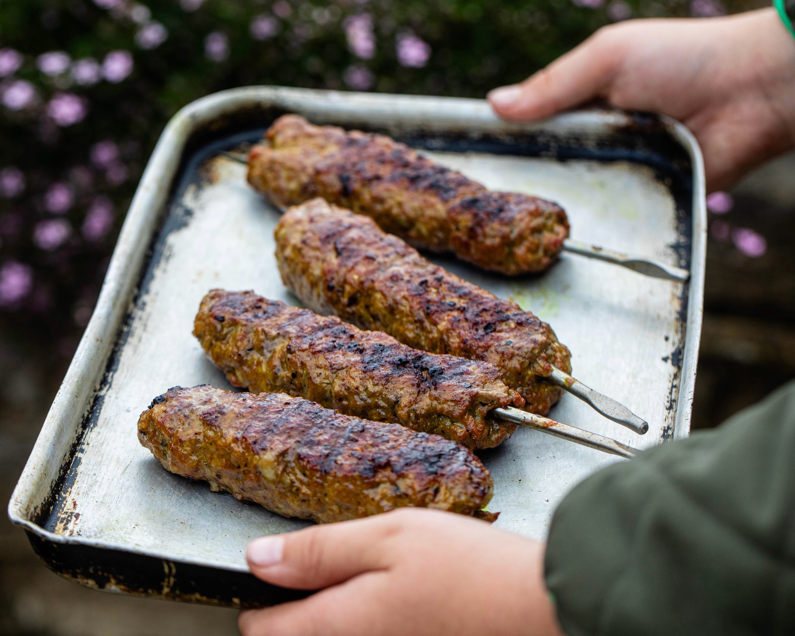 A limited summer special from @thisplacetastesdelicious Anna Ansari, Iranian-American writer and author of Silk Roads. Her Hogget Koobideh, made with Swaledale’s minced hogget, seasoned with just the right amount of turmeric, onion and salt. In her words:
“I grew up on summers filled with fireflies, hydrangeas, watermelon, sweetcorn, heat, humidity … and koobideh. Always koobideh. Juicy, extraordinary koobideh. Possibly the most beloved and recognisable Iranian kebab, koobideh is pretty good even when it’s bad … and this one, made with Swaledale’s exceptional minced hogget, is truly special. Serve with steamed basmati rice or tucked into flatbread, but always finish with a generous sprinkle of sumac.”
You can find more recipes from Anna over on our journal.